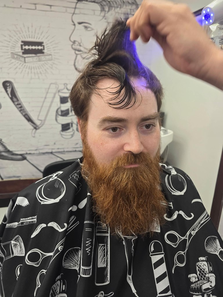 Before — long ginger beard in the chair at Willie's