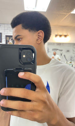 After — fresh side-part fade, big smile