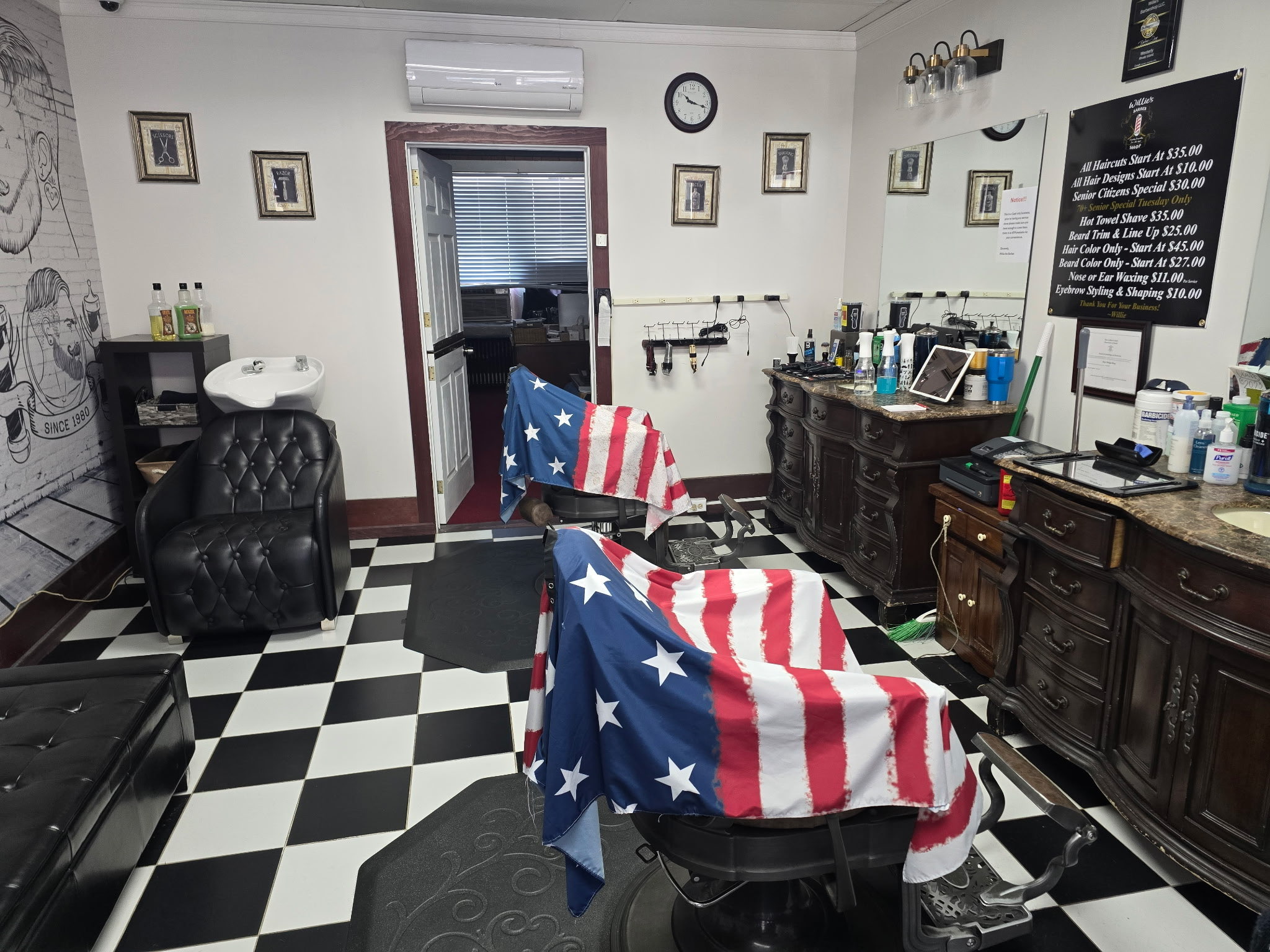 The chair at Willie's — flag cape, checkered floor, Westerly